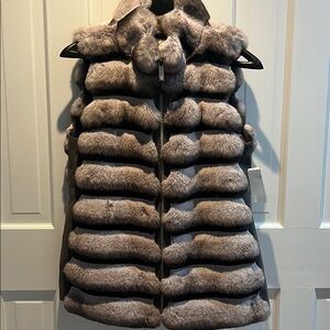 Beautiful faux fur vest. Grey and black.